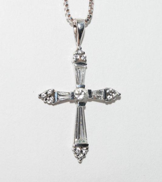 Sterling Silver CZ Cross Necklace: This Sterling Silver religious cross pendant has multiple CZs and measures 21.7 x 36.8mm on a 1.3mm 20inch chain.