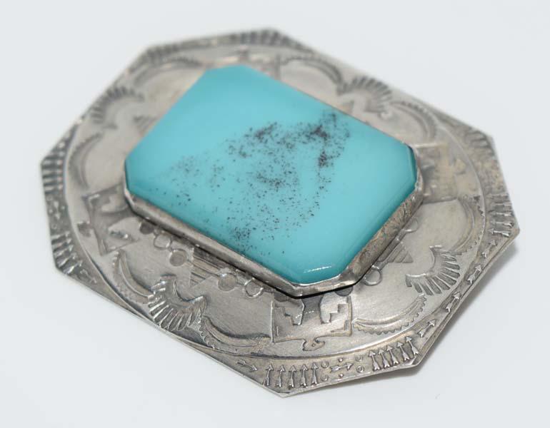 Native American Sterling Eagle & Sun Stamp Brooch: Native American sterling silver eagle and sun stamp brooch with acrylic turquoise color center | Measurement: 33m x 42mm