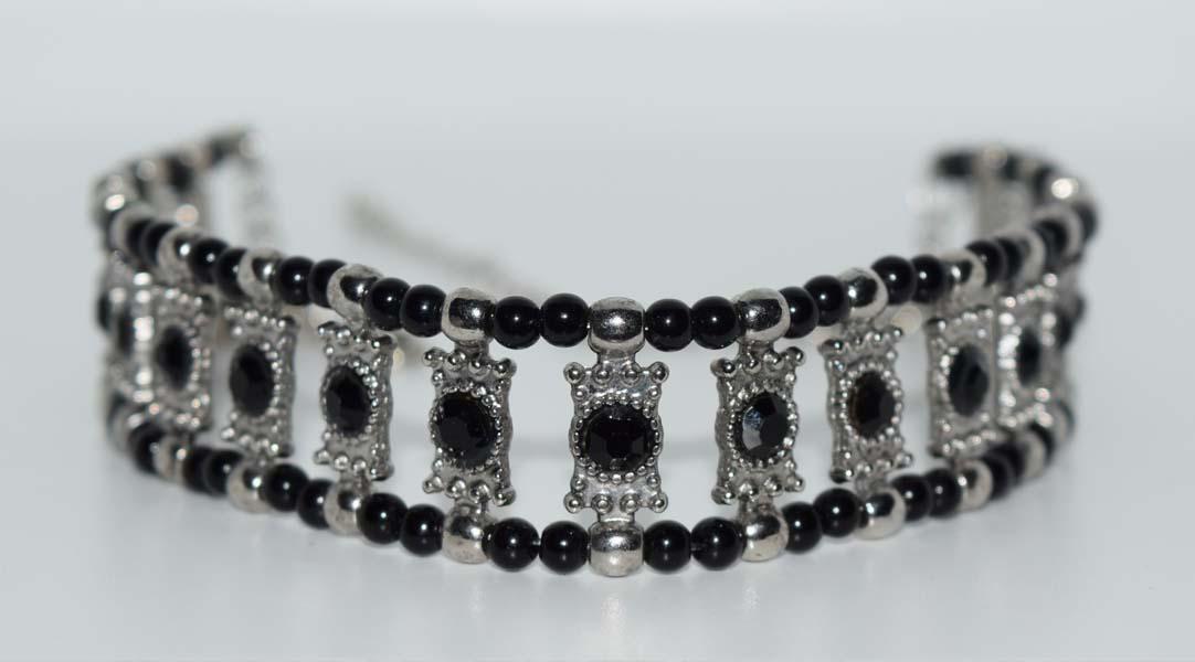 Silver Tone & Black Bead Choker Necklace: Silver tone and black bead choker necklace | Measurement: 11” â€“ 15” length, 20.4mm width