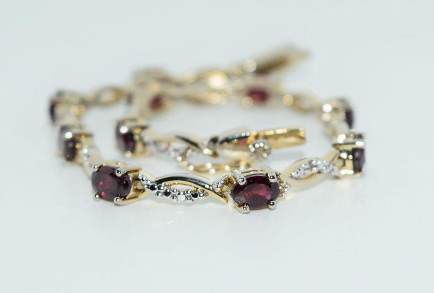 Gold over Silver Amethyst Tennis Bracelet: This tennis bracelet has 4 x 6mm Amethyst stones, 7.5inch long, is stamped 925 FAS & weighs 9.9 grams.