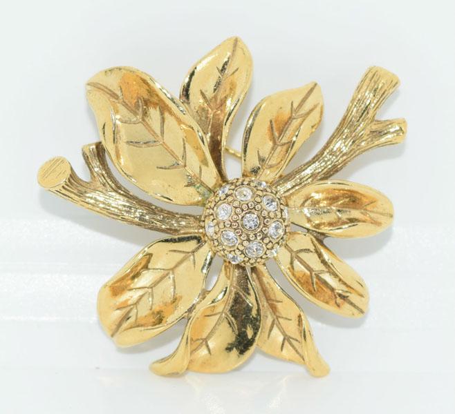 VTG Costume Monet Flower Brooch: This gold tone & rhinestone Monet stamped flower brooch measure 47 x 44.5mm.
