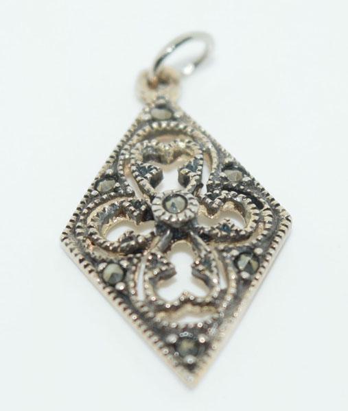 Sterling Silver Marcasite Diamond Shape Charm: This charm is measures 24.8 x 13.6mm & is stamped 925 & unknown makers mark.