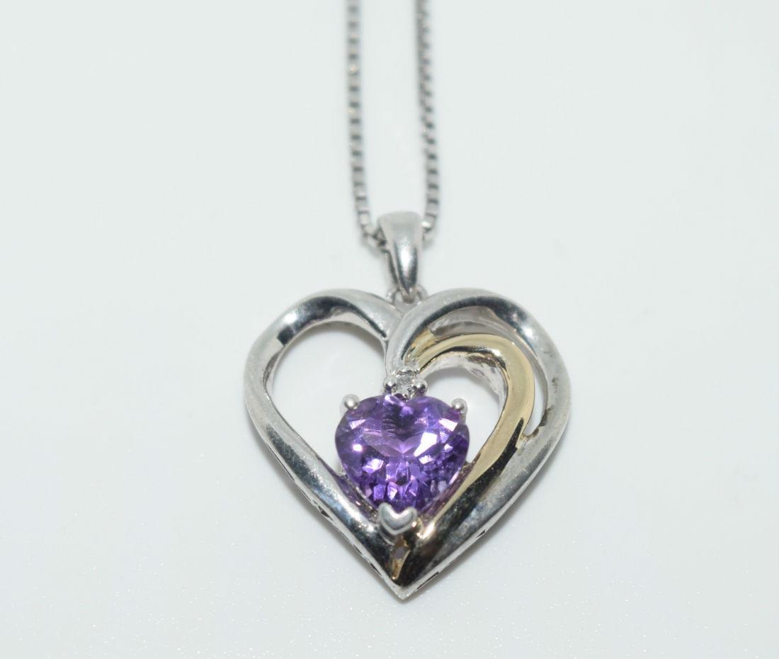 Sterling Amethyst & Diamond Heart Necklace: Sterling silver amethyst and diamond heart pendant necklace | Measurement: 17.5” length, 22mm pendant drop, 17.4mm width