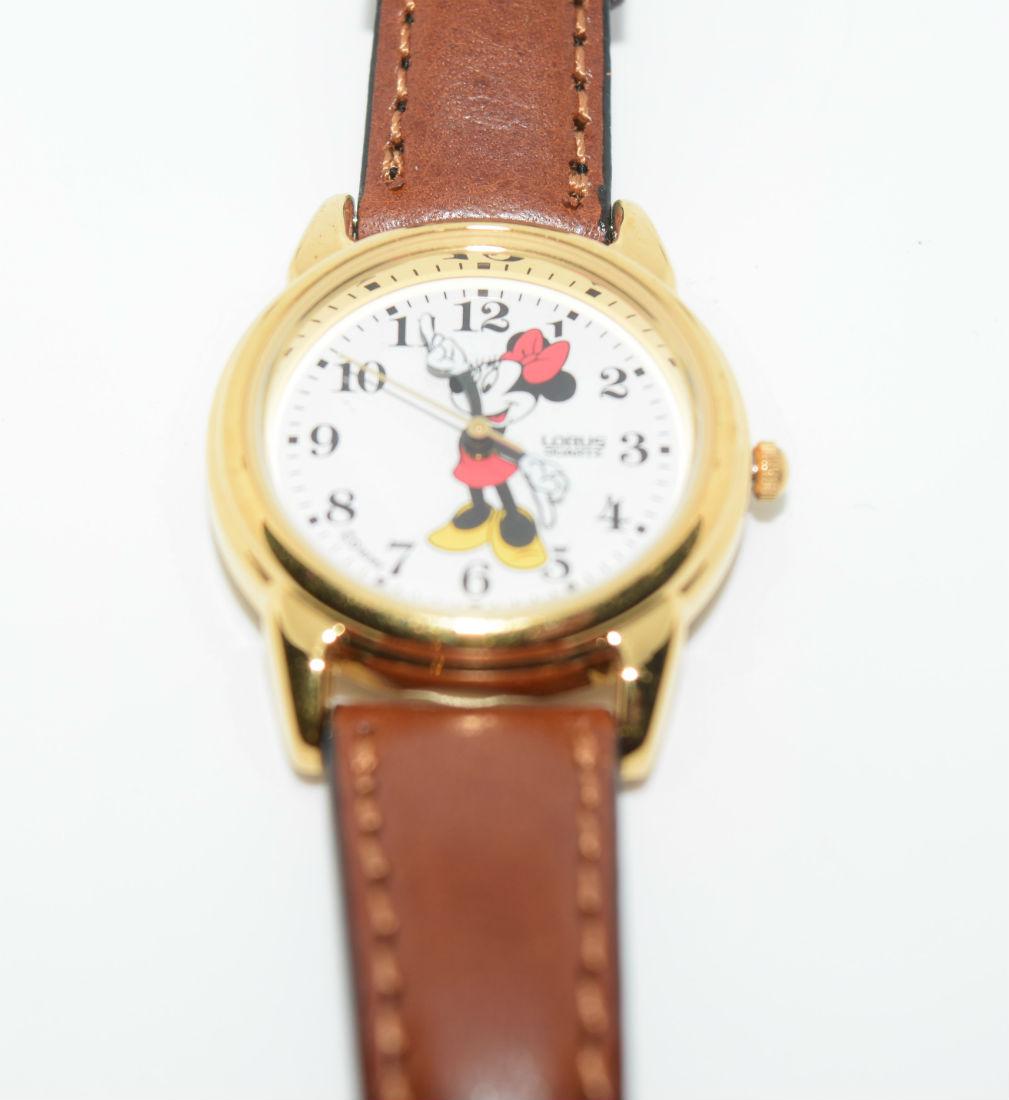 Lorus Minnie Mouse Leather Band Watch New Battery: Lorus Disney's Minnie Mouse gold tone face and brown leather band watch | Note: new battery | Measurement: 1" face