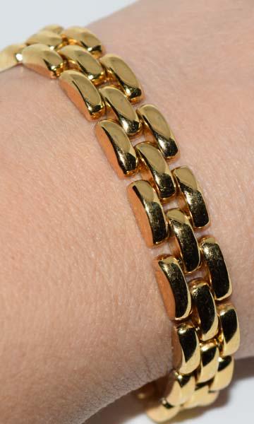 Italian Gold Over Sterling Panther Link Bracelet: Italian gold over sterling sivler panther link bracelet | Measurement: 7” length, 10mm width