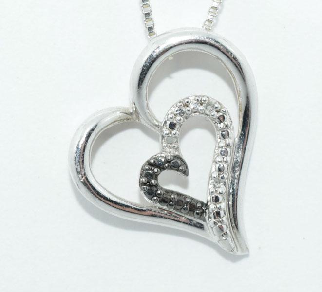 Sterling Black & White Diamond Accent Heart Necklace: This pendant measure’s 19 x 17.5mm on a 21inch box chain & stamped 925 SUN & tested black & white diamond Accents.
