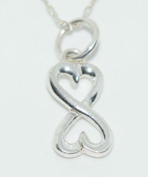 Sterling Silver Eternity Heart Necklace: This pendant measure’s 14.3 x 7mm wide on a 21inch chain & stamped 925 LA.