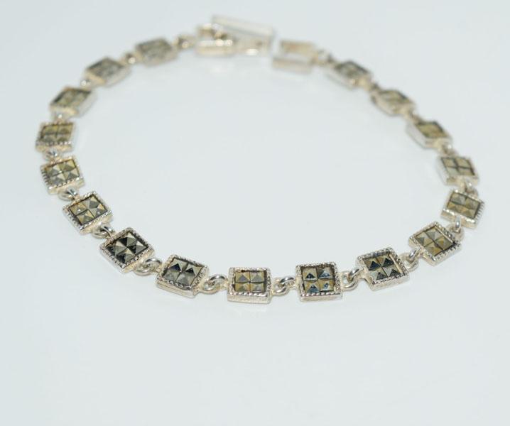 Sterling Square Marcasite Link Bracelet: This bracelet measures 5.5mm wide 7inches long weighs 10.33grams & stamped 925.