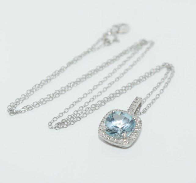 Sterling Silver Blue Halo Stone Necklace: This pendant measure’s 18 x 11.2mm with a 8mm Light blue stone on an 18inch chain & stamped 925 FAS.