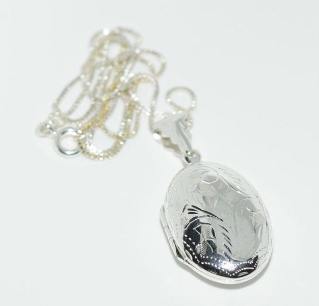 Sterling Silver Etched Oval Locket Necklace: This pendant measures 18mm wide with a 37.8mm drop on an 18inch box chain & stamped FAS 925.