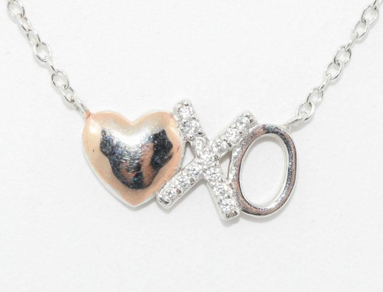 Sterling Silver Heart X O Charm Necklace: This necklace measures 7.8mm wide & 16-18inch necklace & stamped 925 LA CN.