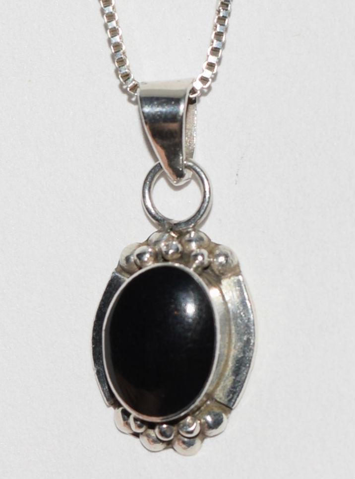 VTG Silver Oval Onyx Necklace: This Vintage Silver Oval Bezel set Onyx pendant measures 12.4mm wide with a 26.7mm drop on an 18.5inch box chain.