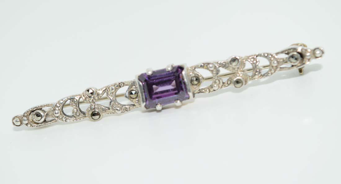 Vintage 800 Silver Brooch: This brooch is 55.4mm x 7.4mm with a 7.5x6mm emerald cut center stone and marcasite’s surrounding. Tested to be 800 silver.