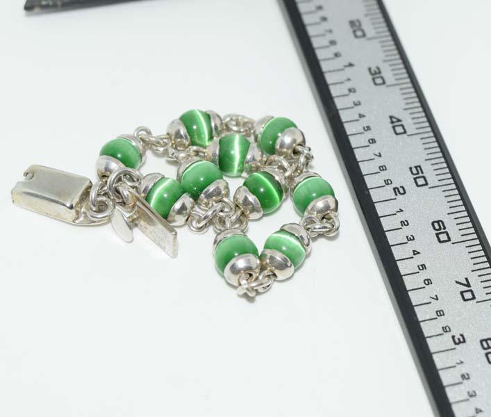 Mexico Sterling Cats Eye Bracelet: This bracelet measures 6mm beads 7inchs long & stamped Taxco Mexico 925.