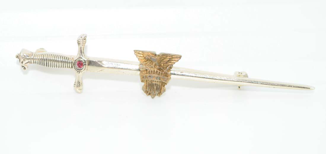 1947 USMA Balfour Sterling & Ruby Sword Pin: This brooch is 2.75-inches long and 11mm at its widest point. Has an eagle on the top and 1947, USMA below the eagle. Tested to be 92.5% silver