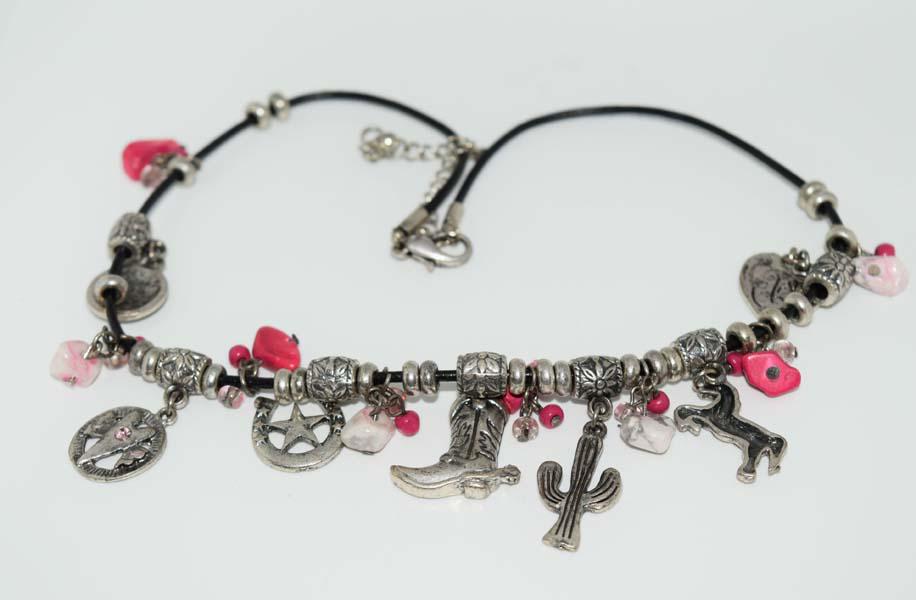 Cowgirl Up Fashion Charm Necklace: This necklace is 16-19 inches long with cowgirl style charms and pink died stones throughout on a black cord chain.