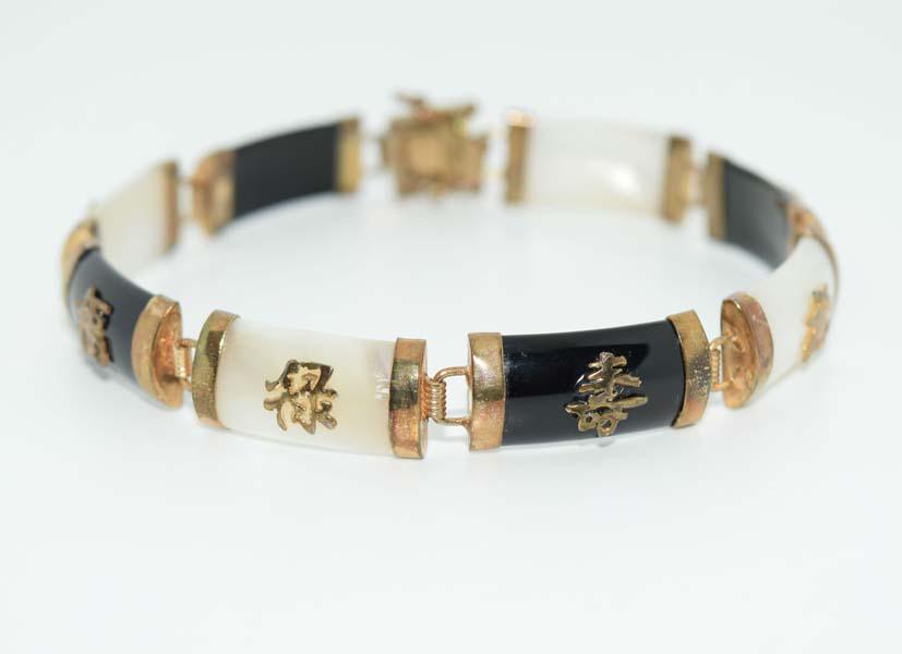 Chinese Mother of Pearl Onyx Link Bracelet: This bracelet measures 9.6mm wide face 7inches long & stamped JC.