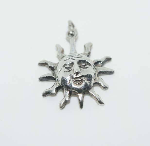 Tested Sterling Face in Sun Charm: This charm measures 17.8 x 21mm with unknown makers mark & tested Sterling.