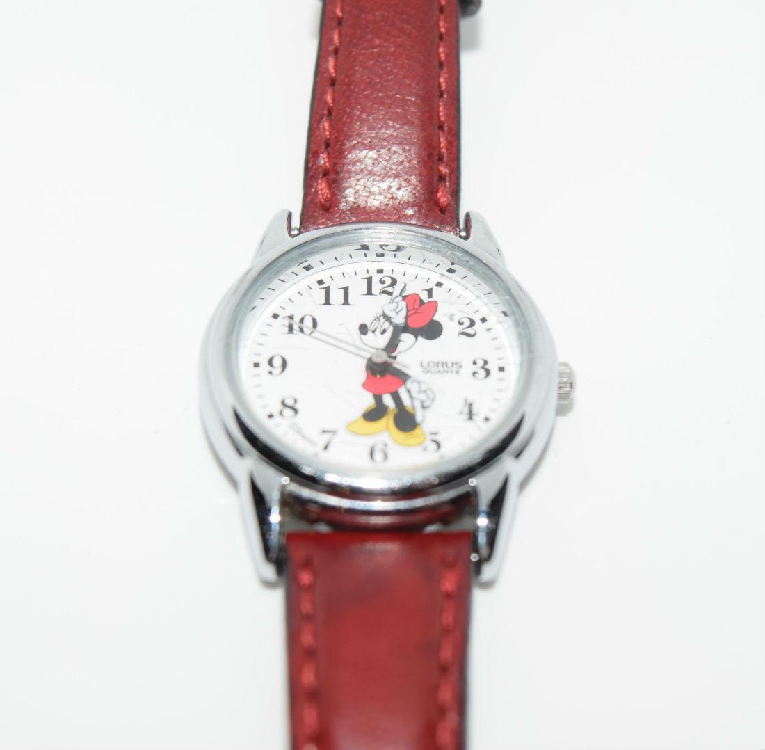 Lorus Disneys Minnie Mouse Red Leather Band Watch: Lorus Disney's Minnie Mouse silver tone face and red leather band watch | Note: needs new battery, scratches on edge of face | Measurement: 1 inch face
