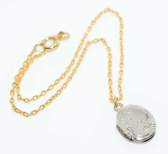 Gold & Silver Tone Locket Bracelet: Measurement: 7.5 inch length, 15.5mm x 9.4mm locket