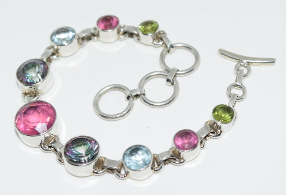Sterling Peridot Topaz & Spinel Link Bracelet: This bracelet measures 12.5mm at widest point 6.75-8 inches long & stamped 925 with tested gemstones.