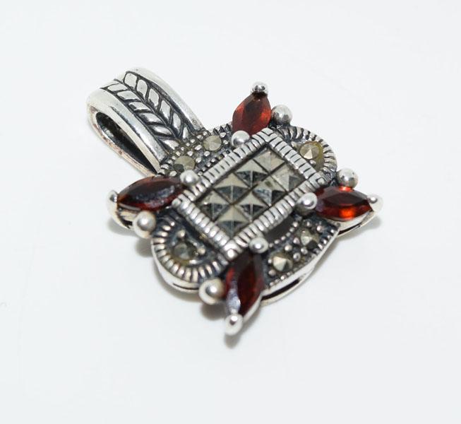 Sterling Garnet & Marcasite Vintage Design Necklace: This pendant measures 17mm wide with a 23.6mm drop on a 15inch cord necklace & stamped 925.