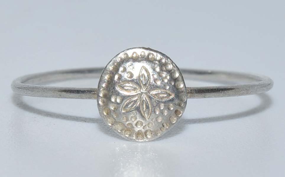 Dainty 800 Silver Sandollar Ring Sz 5.5: Measurement: 6mm face | Size: 5.5 | Weight: 0.3 grams | Stamp: tested 800 silver