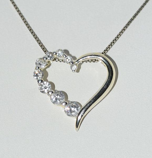 Sterling Silver Journey Heart Necklace: Weighs 4grams Measures 22.8mm wide 22.8mm drop 21inch box chain Stamped 925