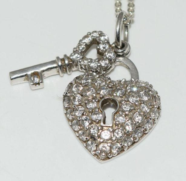 Sterling Sparking Key & Locket Necklace: Weighs 6grams Measures 15.9mm wide 27mm drop 17-19inch baroni chain Stamped Canada 925