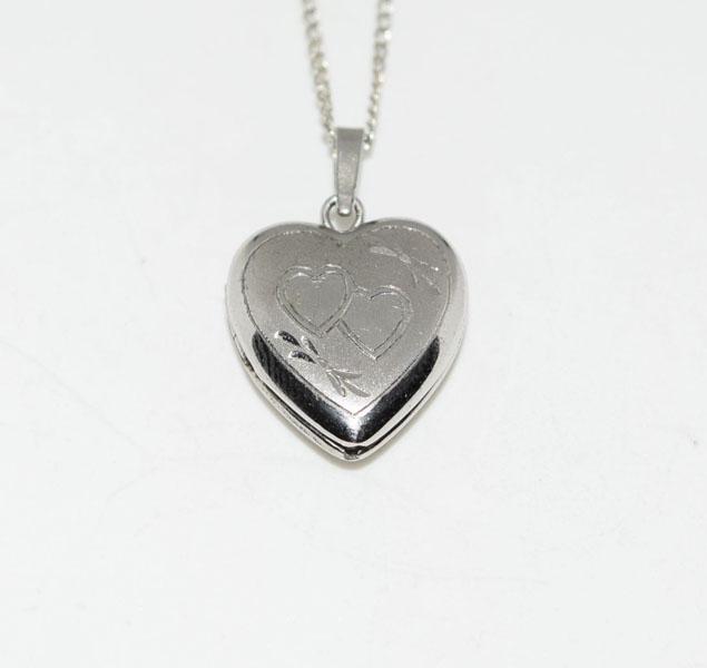 Sterling Small Etched Heart Pocket Necklace: Weighs 2.5grams Measures 12.8mm wide 19.5mm drop 18inch chain Stamped 925 Sterling R