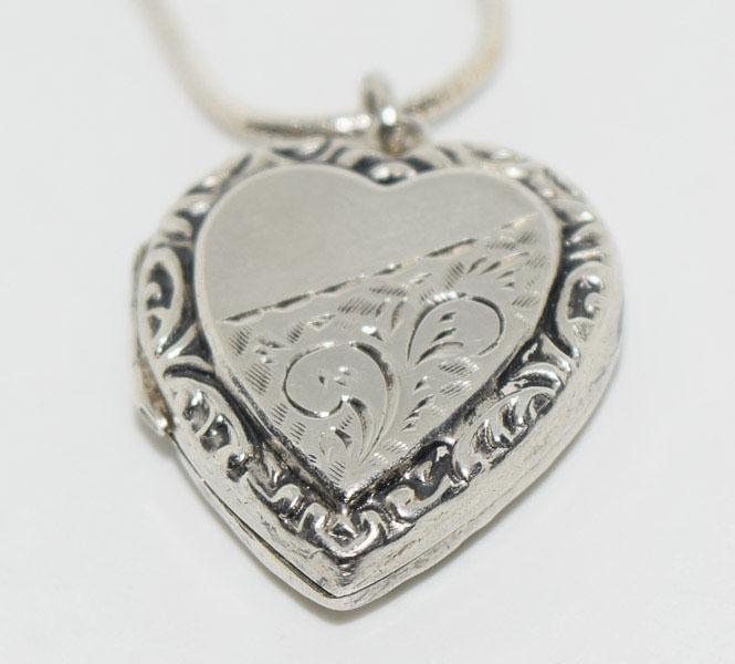 Sterling Swirl Etched Heart Locket Necklace: Weighs 8.2grams Measures 19.6mm wide 25.5mm drop 16inch 1mm snake chain Stamped Silver 925 Italy