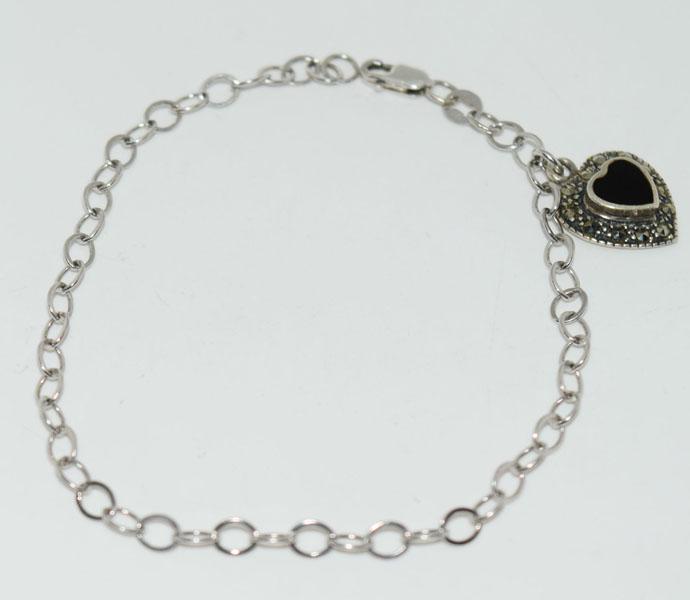 Sterling Silver Marcasite Heart Charm Bracelet: Weighs 3grams Measures approx. 17.5mm x 13mm heart charm 7.5inch long link chain Stamped 925 SU