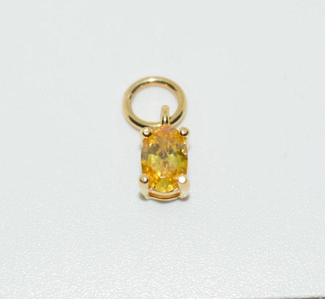 Gold over Sterling Small Oval Cut CZ Charm: Weighs .5grams Measures 4 x 5.5 CZ Stamped 925 CZ