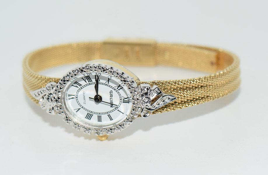 Gruen Diamond Accent Womens Watch: Weighs 18.6grams Measures 6mm wide band adjustable 7inch band 19mm wide face Stamped JB USA Tested Diamond in face