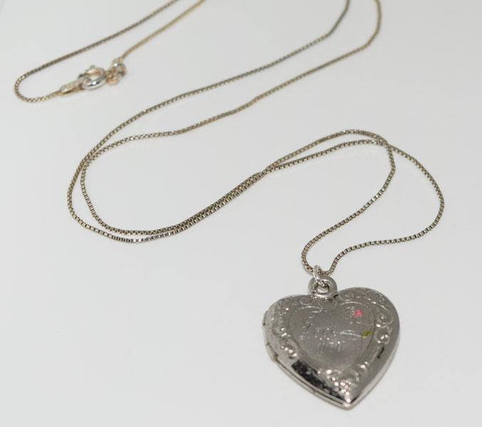 Vintage Sterling Etched Heart Locket Necklace: Weighs 4.5grams Measures 19.6mm wide 1inch drop 19inch Box chain Stamped 925 K Dent in front