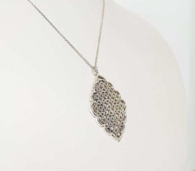 Sterling Paloma Picasso Marrakesh Tiffany & Co Necklace: Weighs 5.74grams Measures 38.5 x 28.6mm 16inch Chain Stamped Tiffany & Co. lowest selling price found $399