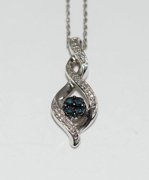 Jane Seymour Sterling Blue & White Diamond Necklace: Weighs 3.26grams Measures 9.5mm wide 24.5mm drop 18inch chain Stamped 925 JWBR Tested Blue & White Diamonds
