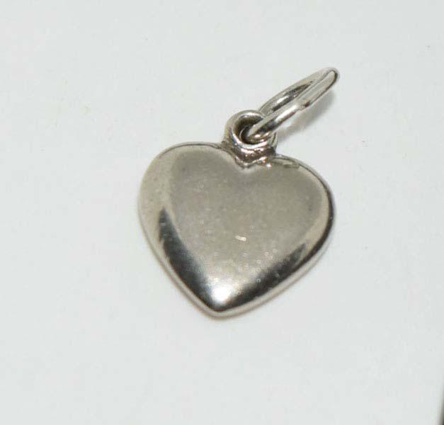 Sterling Silver Dainty Heart Charm: Weighs .5grams Measures approx. 10-11mm Stamped Ster