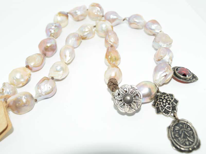Love Heals Baroque Pearl Necklace: This necklace measures 16-18inches long, 10-15mm Baroque Pearls with Love Heals Tag. Resell online is between 250-3,500!