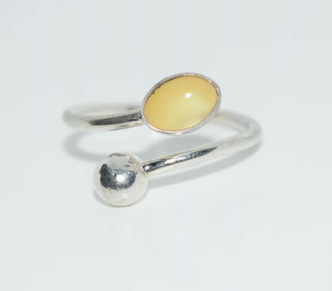 Silver Tone Adjustable Wrap Ring: This ring is 10.5mm at its widest point and is adjustable.