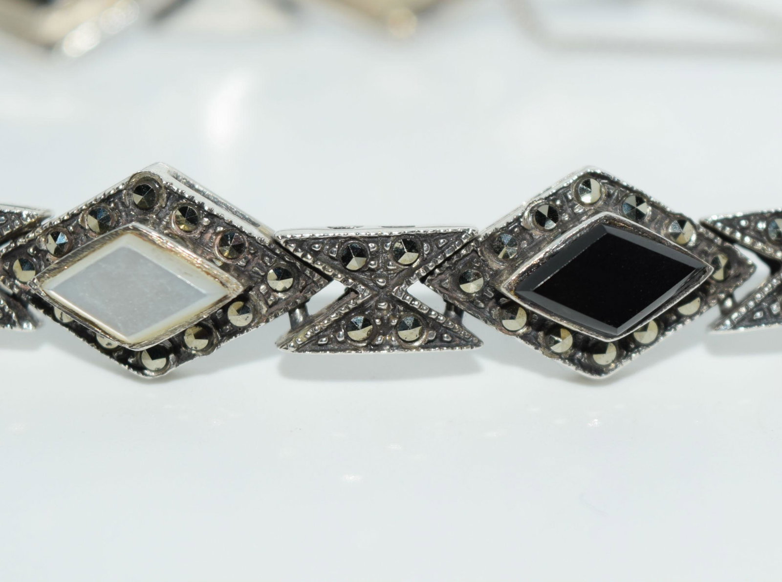 Sterling Silver Onyx Marcasite MOP Bracelet: Weighs 24.22grams Measures 11mm wide 7inches long Stamped 925