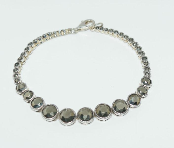 Sterling Silver Graduating Marcasite Bracelet: This bracelet measures 7.5mm wide 7inches long weighs 11.24grams & stamped 925.
