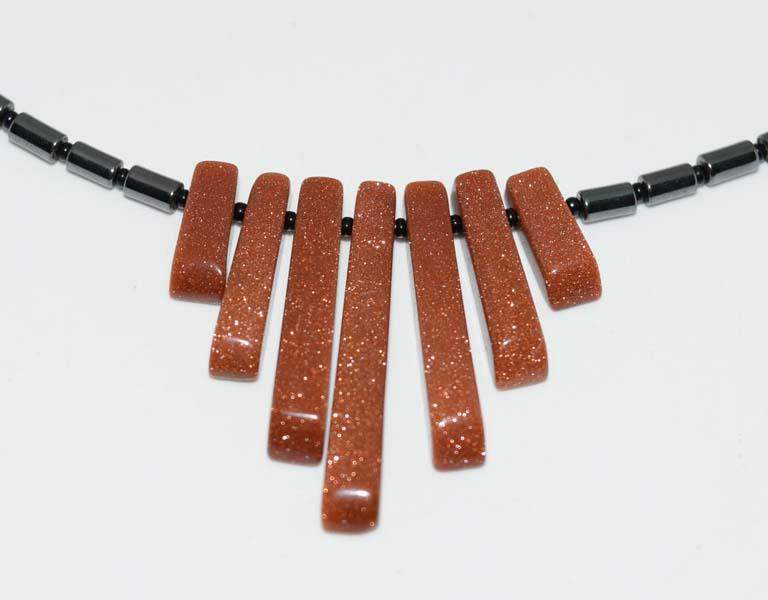 Hematite Beaded Graduated Goldstone Necklace: This necklace measures a 1.11inch drop & 19inchs long.