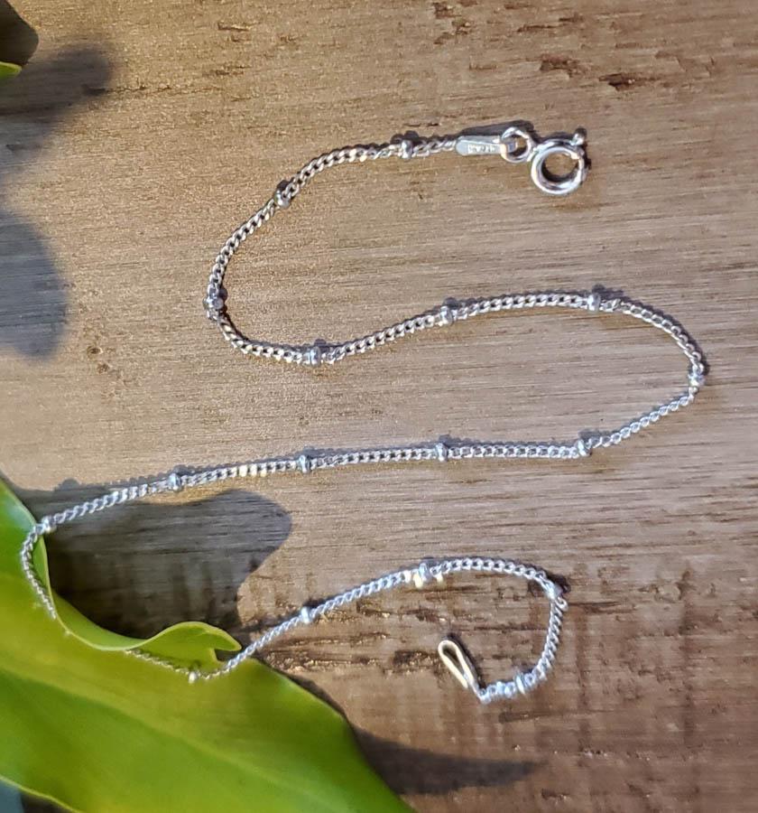 Sterling Silver Anklet or Bracelet: Item Details:Sterling Silver Anklet or Bracelet Type: Sterling Silver Anklet Bracelet Length: 10 Inches Width: 2 mm Other: Stone Type: None Stone Cut: None Stone Color: None Shape/Style: N/A Carats: N