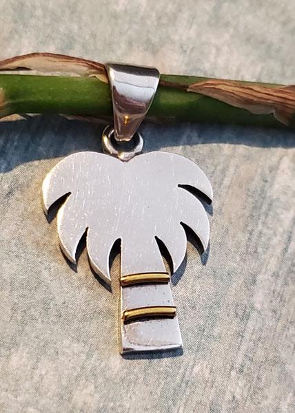 Sterling Silver Pendant: Item Details:Sterling Silver Pendant Type: Pendant Length: 33.8 mm Width: 19 mm Other: Two Tone Stone Type: None Stone Cut: None Stone Color: None Shape/Style: Palm Tree Carats: None Weight in Grams: 