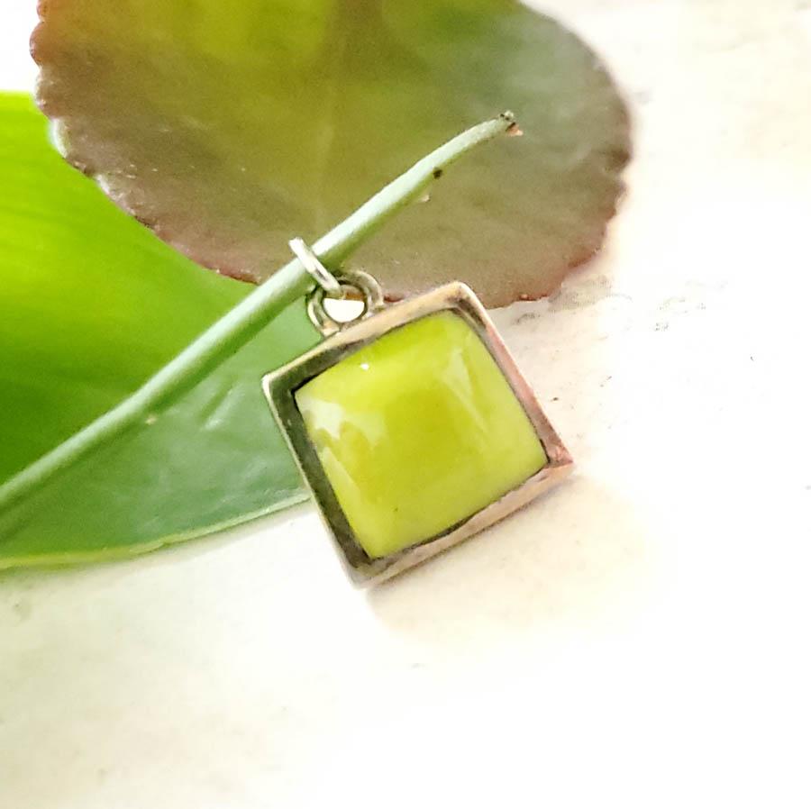 Sterling Silver Chalcedony Charm or Pendant: Item Details:Sterling Silver Chalcedony Charm or Pendant Type: Sterling Silver Charm or Pendant Length: 16.4 Inches Width: 13.8 mm Other: Vintage Stone Type: Chalcedony Stone Cut: Cabachon Stone Color