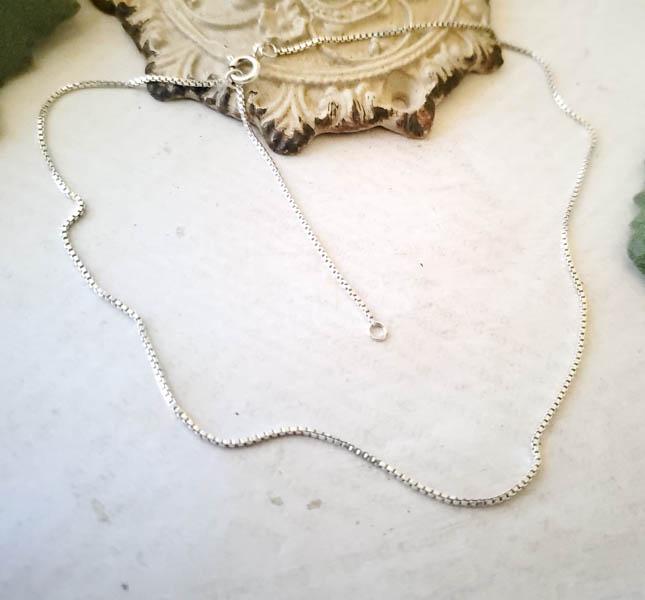 Sterling Silver Chain: Item Details:Sterling Silver Chain Type: Box Chain Length: 16-17 Inches Width: 0.85 mm Other: Spring Ring Closure Stone Type: None Stone Cut: N/A Stone Color: N/A Shape/Style: Box Chain W/ 1inch Exten