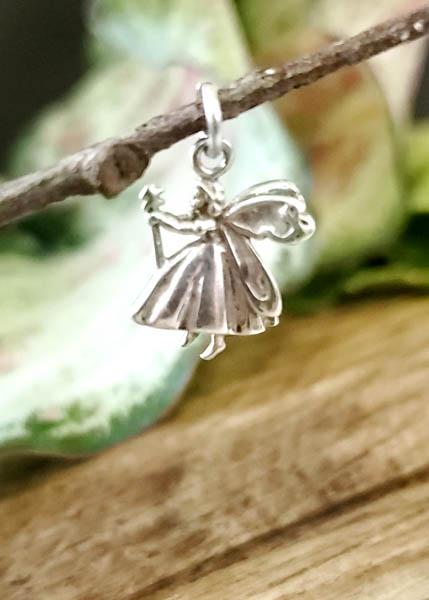 Sterling Silver Fairy Charm: Item Details:Sterling Silver Fairy Charm Type: Charm or Pendant Length: 15.8 mm Width: 12 mm Other: Stone Type: N/A Stone Cut: N/AN/AN/A Shape/Style: Fairy Carats: N/A Weight in Grams: 2 Hallmarks and