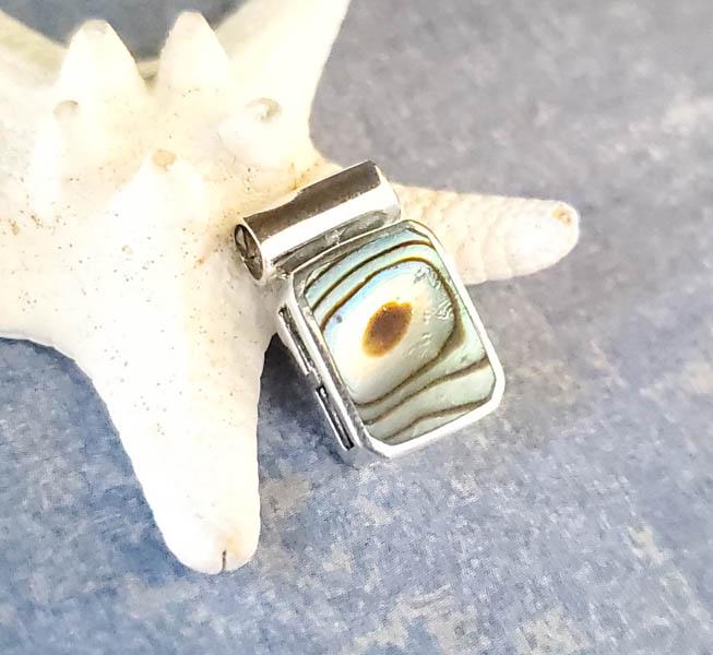 Sterling Silver Pendant: Item Details:Sterling Silver Slide Pendant Type: Pendant Length: 17.5 mm Width: 10.3 mm Other: Stone Type: Abalone Stone Cut: Slice Stone Color: Multi Shape/Style: Rectangle Carats: N/A Weight in Gram