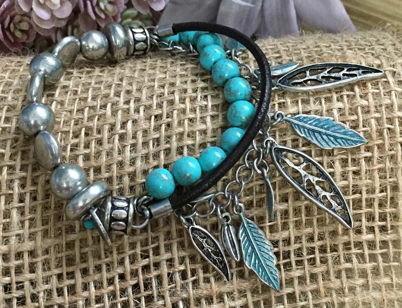 Silver Tone Feather Layered Stretch Bracelet: Item Details: silver tone feather stretch bracelet | Measurement: 3.5 inch diameter | Hallmarks & Stamps: Nine West Vintage America | Weight in grams: | Shipping Time: Usually 2-5 Business Days | Ship
